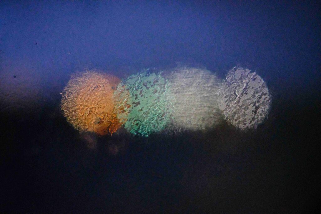 When to Say “I Love You”: How Soon is Too Soon? (& How to Say It) Abstract warm bokeh lights on a window, symbolizing when to say I love you relationship timeline.
