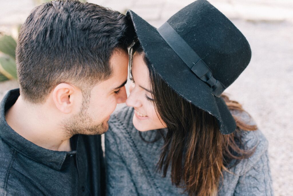 A close-up of a couple leaning their foreheads together, showing tips on becoming a supportive partner.