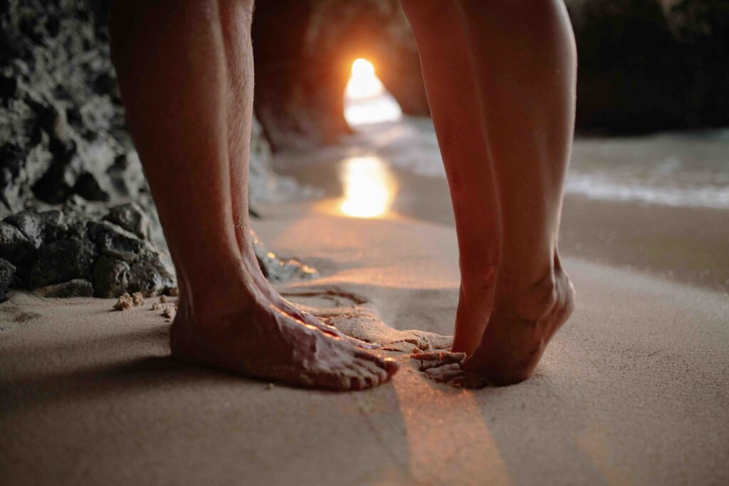 Standing on the beach at sunset, building initial chemistry and comfort while discovering what is first base.