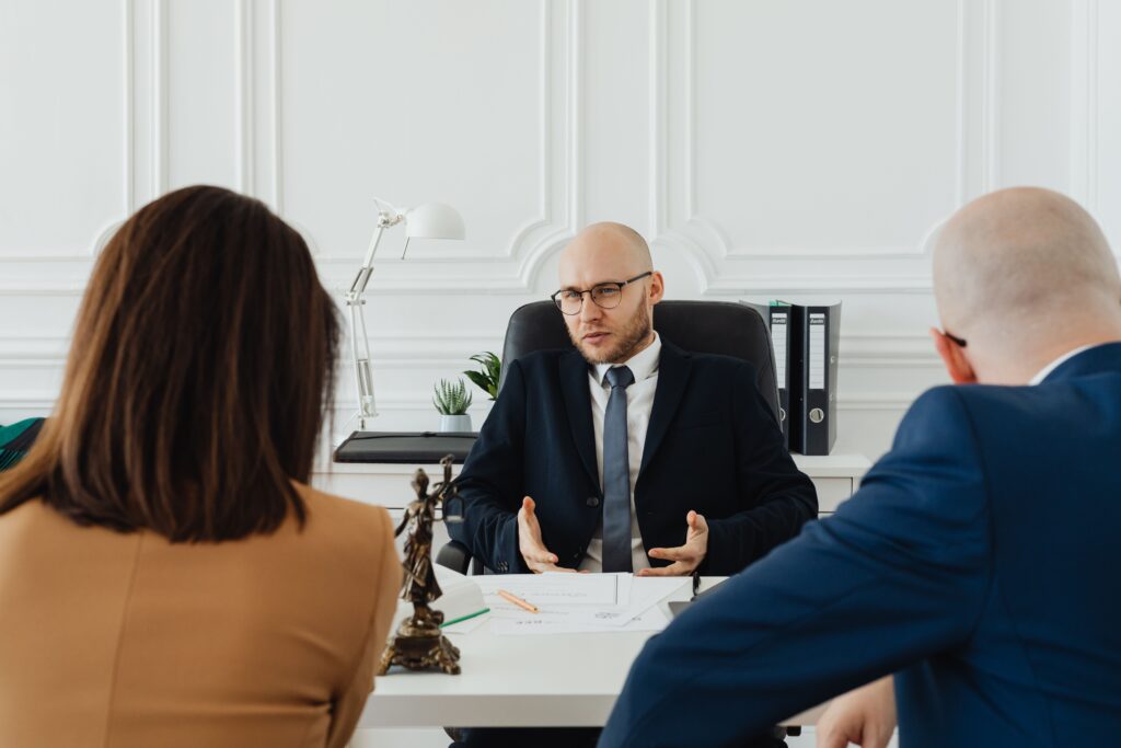 A couple sitting with a family attorney, deciding what to do when a husband is cold to me.