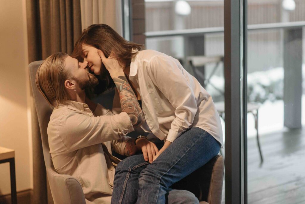 A couple close with noses touching, starting slow to build tension and adjust to each other's rhythm.