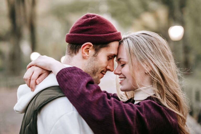 How to Get a Boyfriend: 15 Rules From a Guy’s Mind (2026) A smiling woman embracing a man, exploring real rules from a guy's mind on how to get a boyfriend.