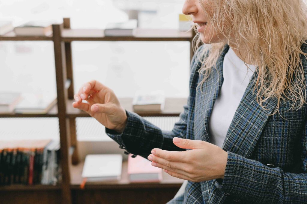 A woman communicating clearly using polite rejection techniques during a conversation.