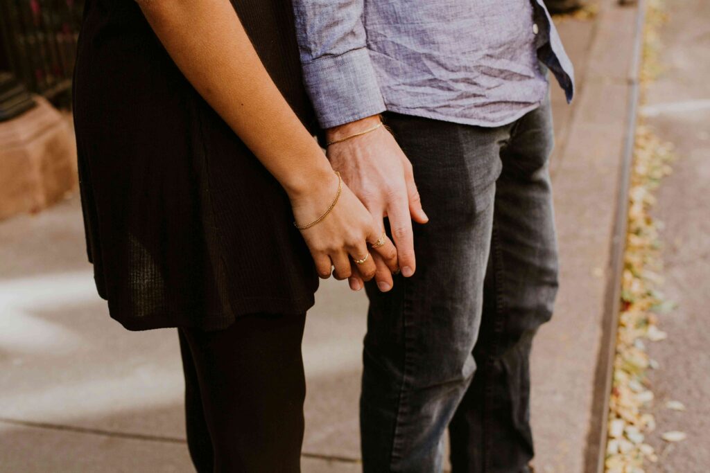 Nice vs Kind: The True Difference (And Why Being Nice Fails in Love) Couples holding hands while comparing nice vs kind behavior in love.
