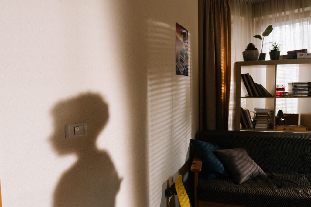 Shadow on a wall of a person representing biological reactivity and highly sensitive person traits. 