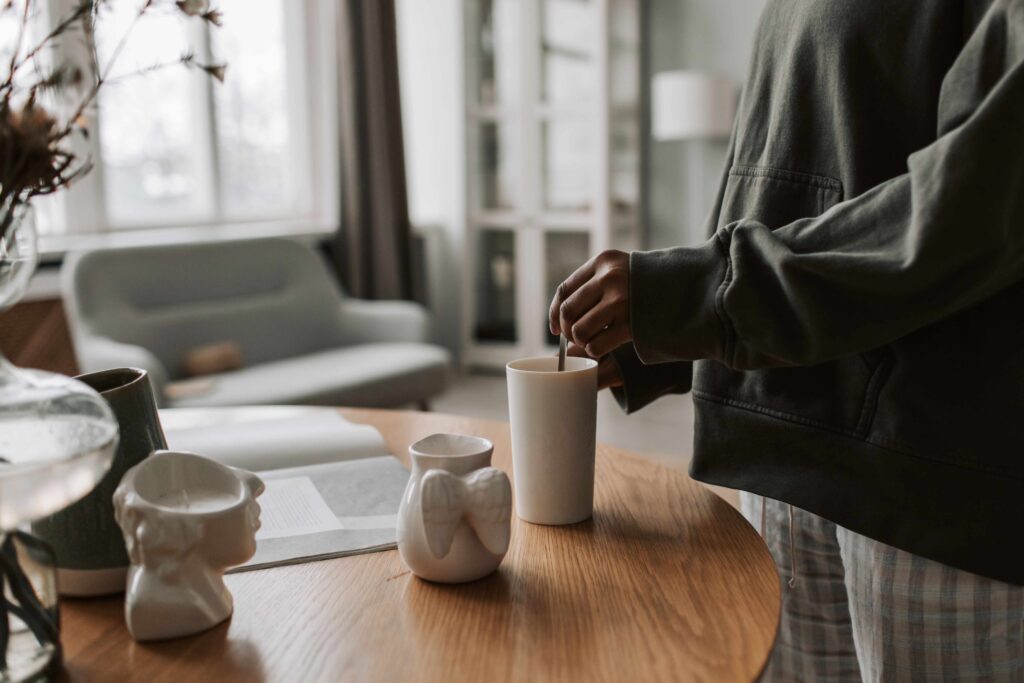 A self-possessed woman making coffee setting boundaries with a serial dater. 