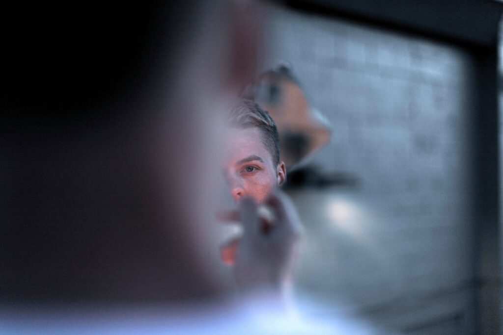Identity Diffusion: 5 Signs You Feel Disconnected & How to Fix It A blurry face reflecting identity diffusion and feeling like an observer in life.