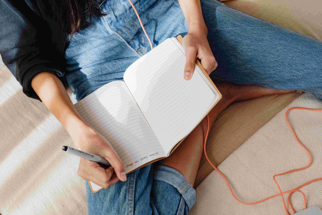 A person journaling actively to process feelings beyond passive time healing all wounds. 
