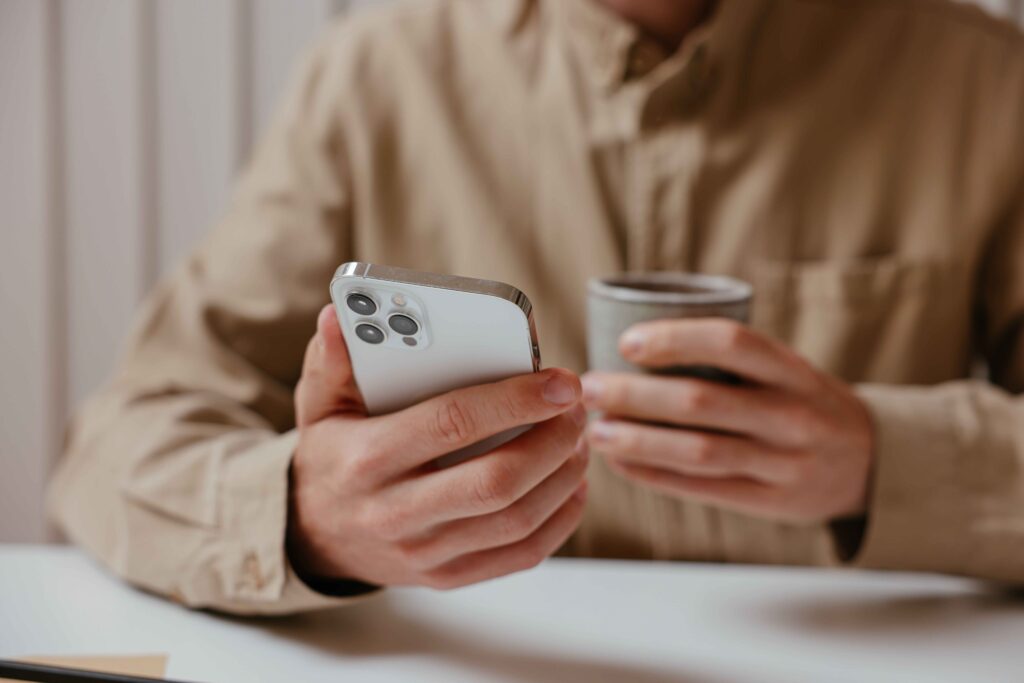 A man keeping his phone face down displaying signs of a player in relationships. 