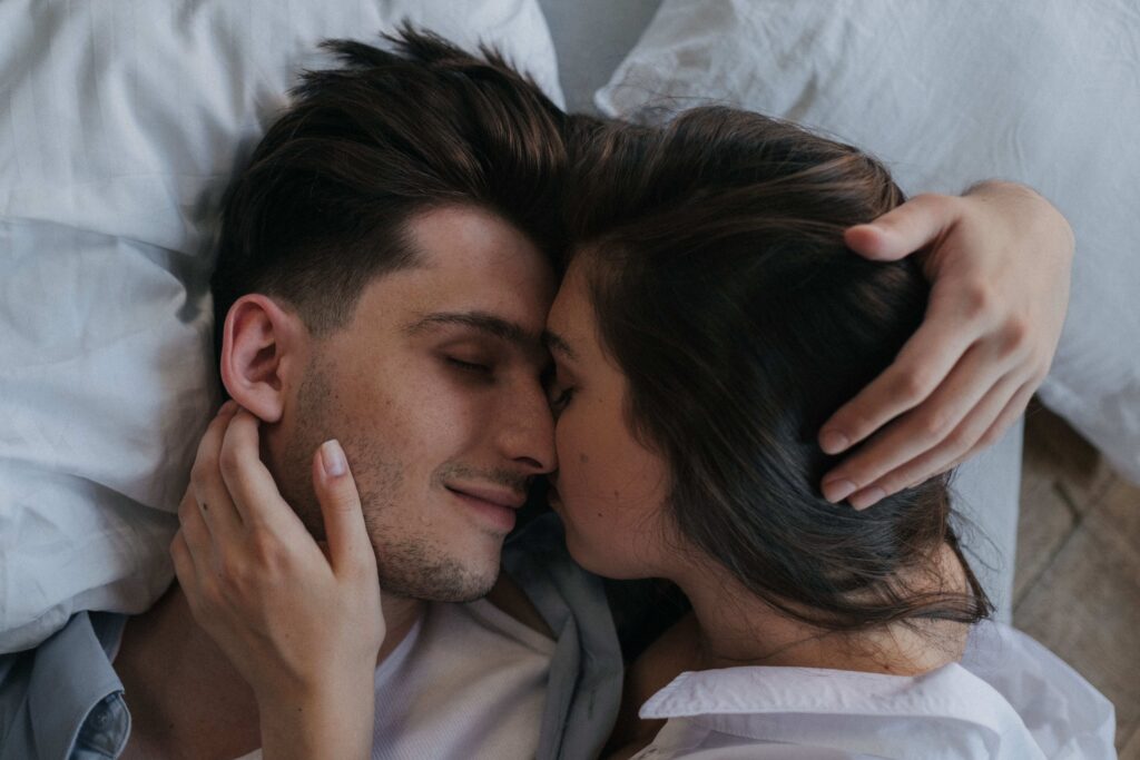 A romantic couple embracing closely sharing emotional love poems for her. 
