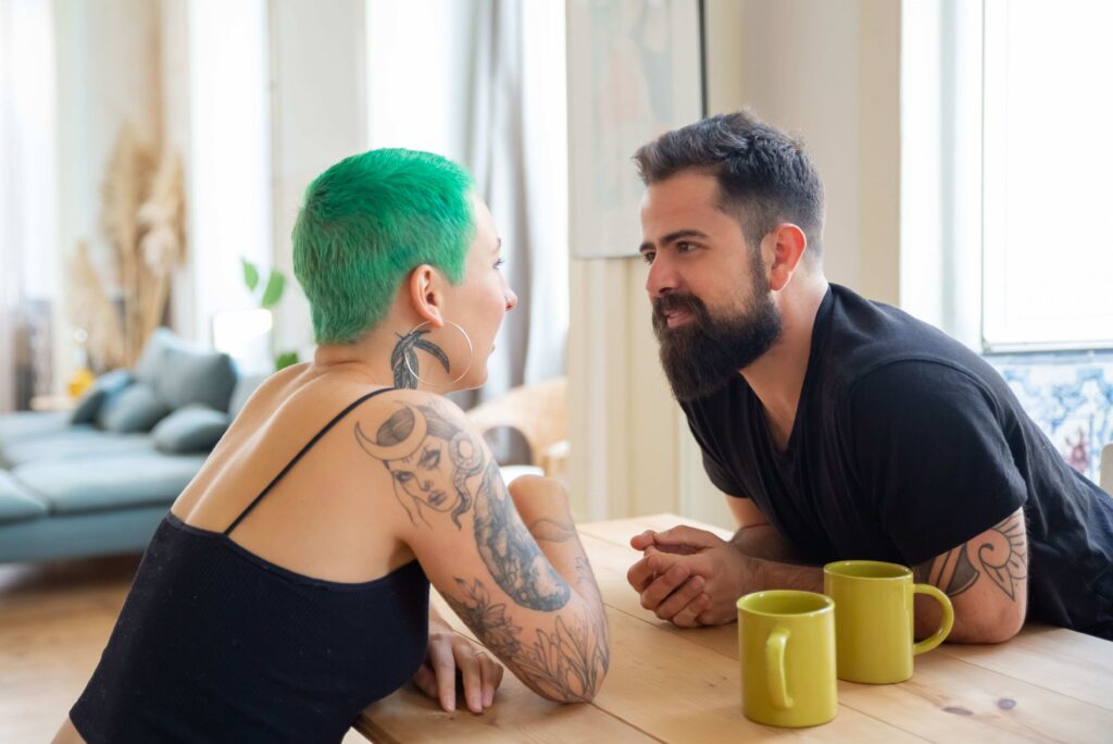 A partner having a deep conversation about physical touch, love language and boundaries.
