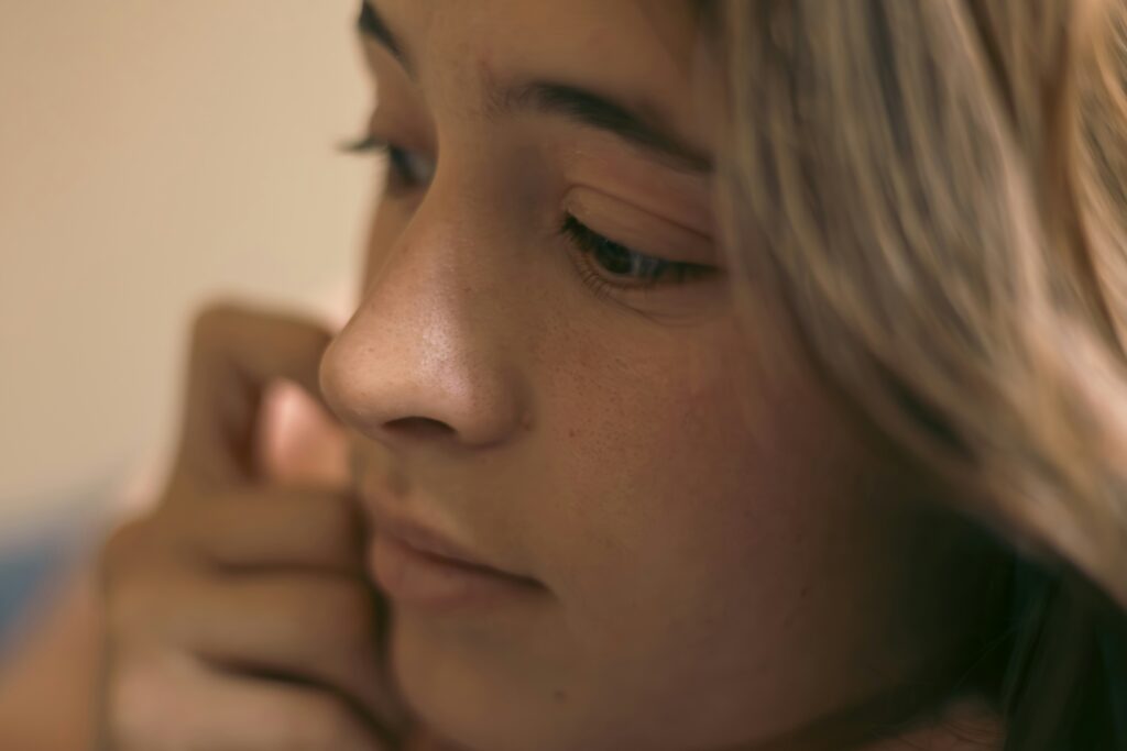 Close up portrait of a thoughtful woman reflecting social intelligence traits.