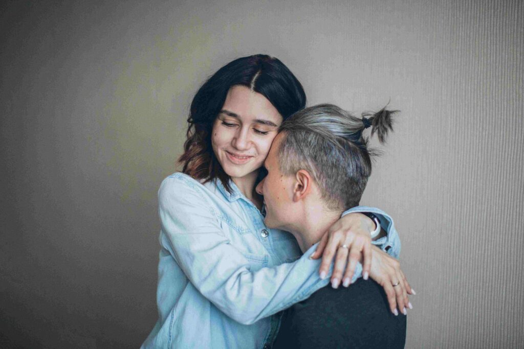 A loving couple hugging closely together practicing constructive marriage dialogue.